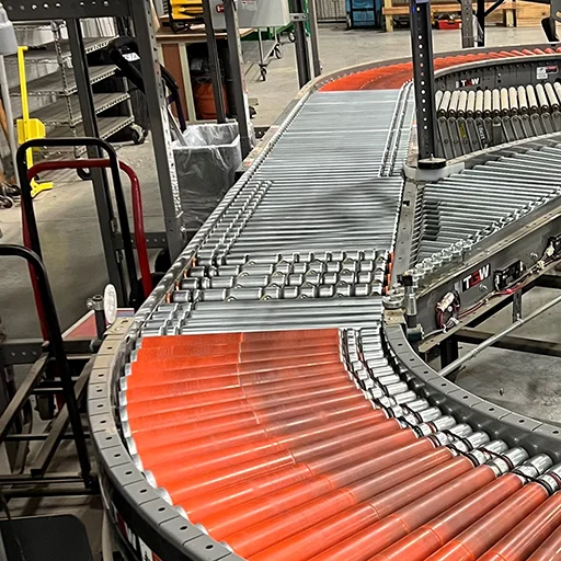 Wheel divert conveyors are used to divert and sort items using embedded wheels to push or divert items off the main conveyor line