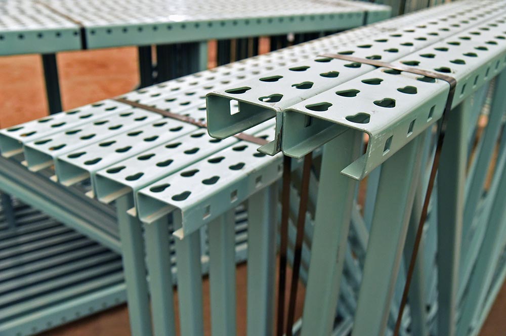 Close-up of teardrop pallet racks upright from the side, highlighting key frame design